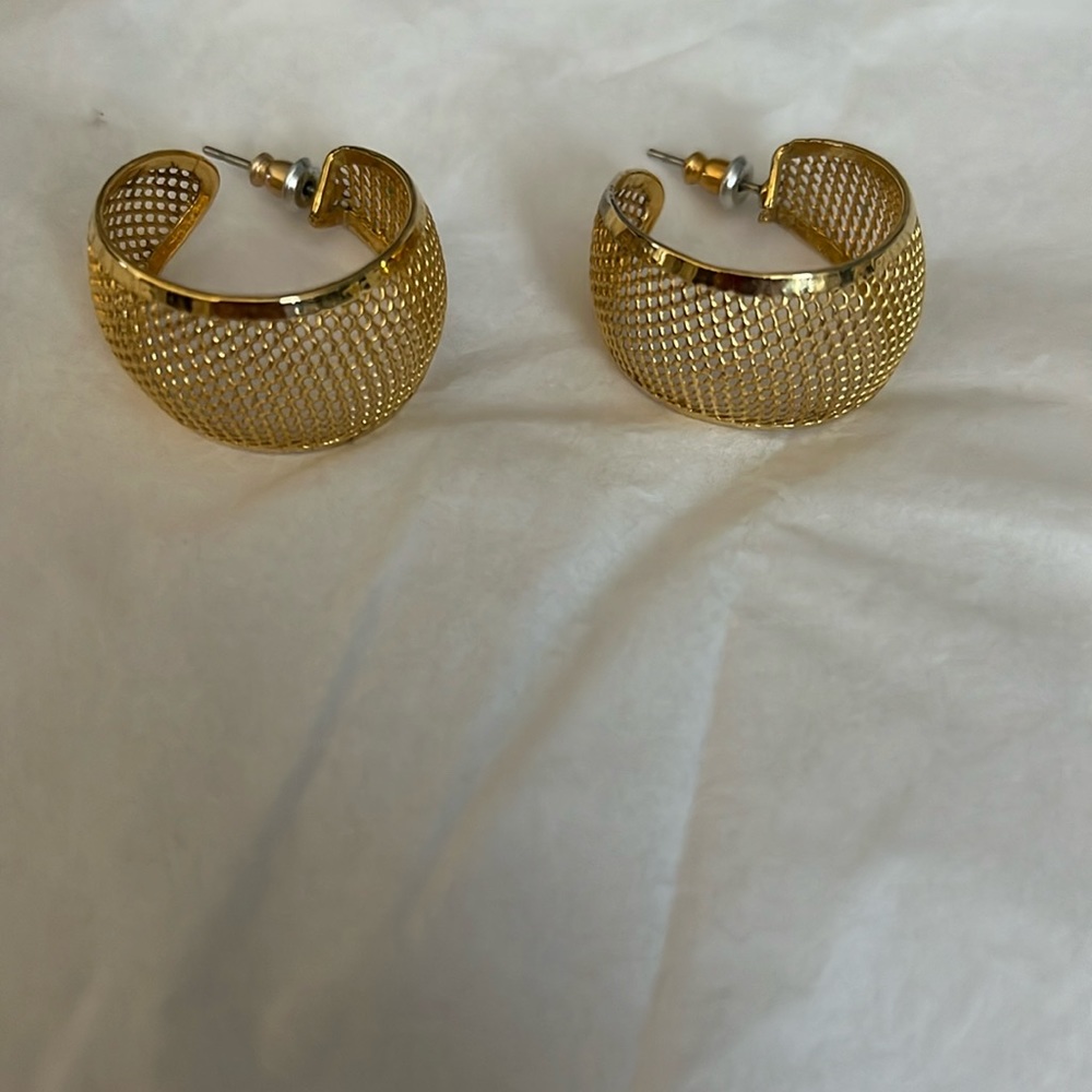 Gold loop earrings.